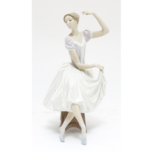 104 - A Lladro figure Weary Ballerina, model no. 5275, depicting a seated ballerina. Marked under. Approx.... 