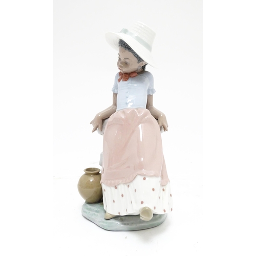 105 - A Lladro figure, A Step in Time, model no. 5158. Marked under. Approx. 8 1/2