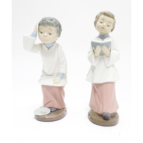 106 - Two Nao figures modelled as choir boys. Marked under. Largest approx. 8 1/2