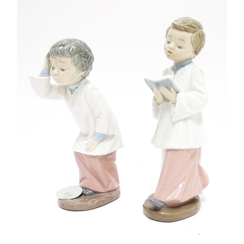 106 - Two Nao figures modelled as choir boys. Marked under. Largest approx. 8 1/2