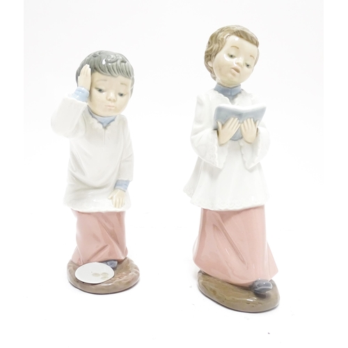 106 - Two Nao figures modelled as choir boys. Marked under. Largest approx. 8 1/2