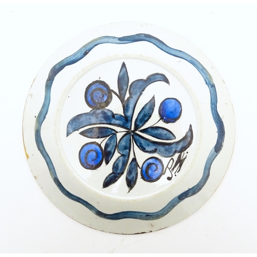 111 - A plate later decorated by studio pottery artist John Pearson decorated with birds and foliate motif... 