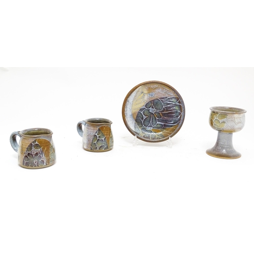 111A - Four Crick Pottery studio pottery wares by Diana Worthy comprising two jugs, a small plate and a gob... 