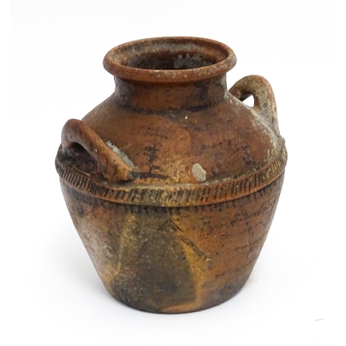 114A - A stoneware pot / vessel with twin handles and traces of geometric detail. Approx. 8