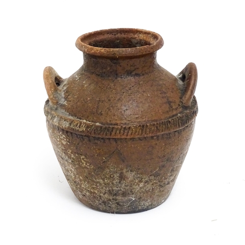 114A - A stoneware pot / vessel with twin handles and traces of geometric detail. Approx. 8