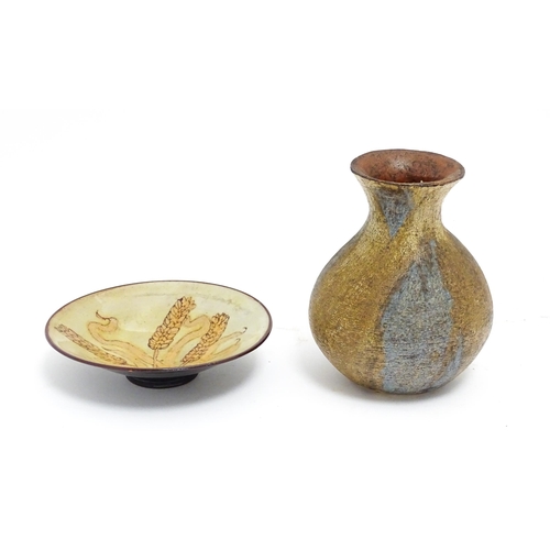 115 - Two items of studio pottery comprising a Chelsea Pottery plate with wheat detail by Hazel Levy, and ... 