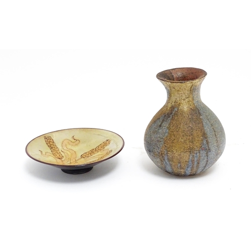 115 - Two items of studio pottery comprising a Chelsea Pottery plate with wheat detail by Hazel Levy, and ... 