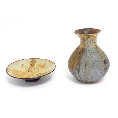 115 - Two items of studio pottery comprising a Chelsea Pottery plate with wheat detail by Hazel Levy, and ... 