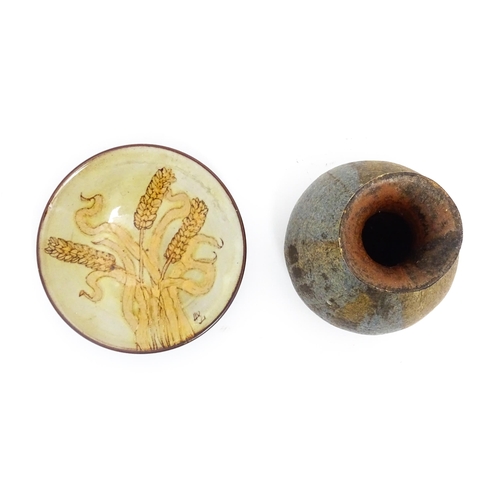 115 - Two items of studio pottery comprising a Chelsea Pottery plate with wheat detail by Hazel Levy, and ... 