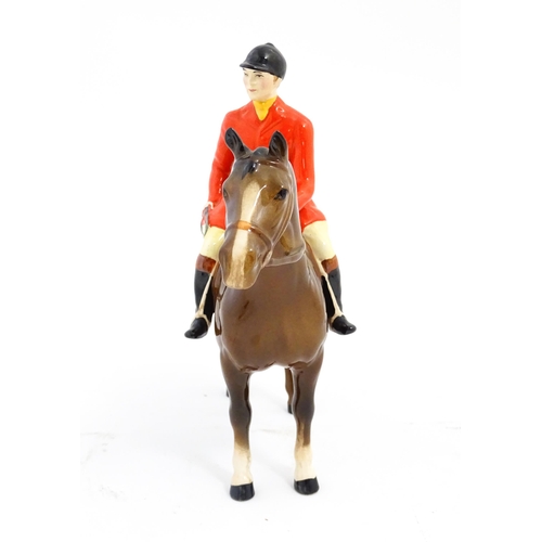 116 - A Beswick Huntsman on a brown horse, model no. 1501. Marked under. Approx. 8