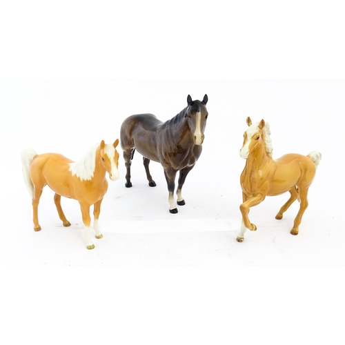 118 - Three Beswick models of horses comprising a palomino Prancing Arab model no. 1261, a palomino Arab h... 