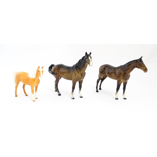 121 - Three Beswick models of horses comprising a brown horse with swish tail, no. 1182, a brown imperial,... 