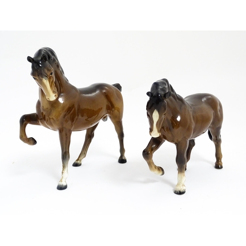 122 - Two Beswick models of horses to include a brown horse with head tucked and leg up, model no. 1549, a... 