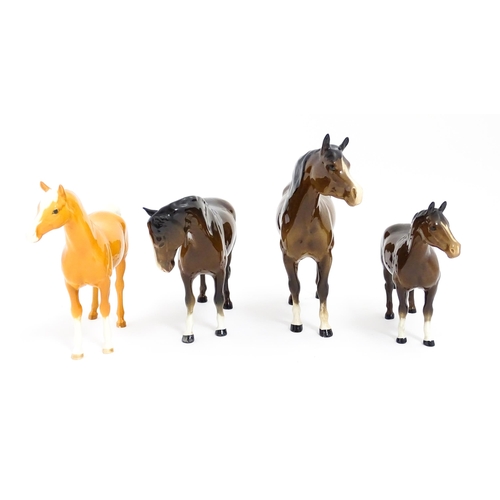 123 - Four Beswick models of horses comprising to include a brown mare, a palomino, and two brown horses. ... 