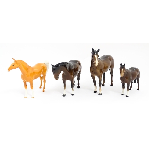 123 - Four Beswick models of horses comprising to include a brown mare, a palomino, and two brown horses. ... 