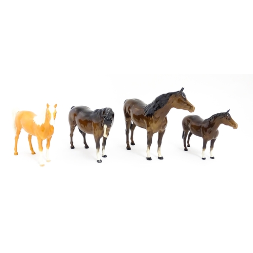 123 - Four Beswick models of horses comprising to include a brown mare, a palomino, and two brown horses. ... 