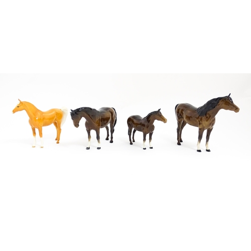 123 - Four Beswick models of horses comprising to include a brown mare, a palomino, and two brown horses. ... 