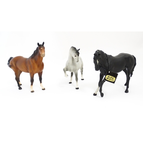 125 - Three Beswick matte models of horses to include Black Beauty no. 2466, a brown swish tail no. 1182 a... 