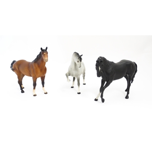 125 - Three Beswick matte models of horses to include Black Beauty no. 2466, a brown swish tail no. 1182 a... 