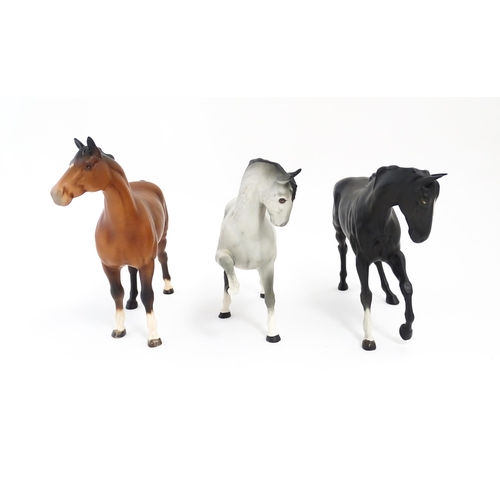 125 - Three Beswick matte models of horses to include Black Beauty no. 2466, a brown swish tail no. 1182 a... 