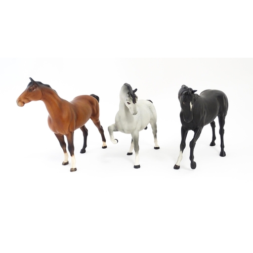 125 - Three Beswick matte models of horses to include Black Beauty no. 2466, a brown swish tail no. 1182 a... 