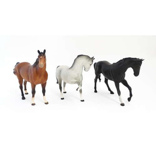 125 - Three Beswick matte models of horses to include Black Beauty no. 2466, a brown swish tail no. 1182 a... 