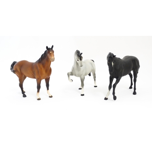 125 - Three Beswick matte models of horses to include Black Beauty no. 2466, a brown swish tail no. 1182 a... 