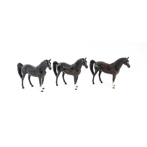 126 - Three Beswick models of dark brown Arab horses. Approx. 6