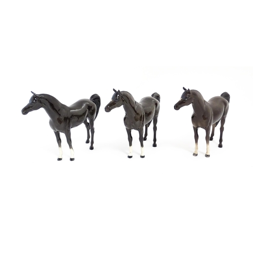 126 - Three Beswick models of dark brown Arab horses. Approx. 6