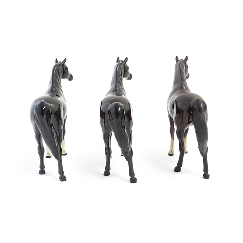 126 - Three Beswick models of dark brown Arab horses. Approx. 6