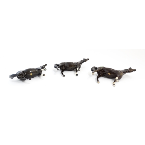 126 - Three Beswick models of dark brown Arab horses. Approx. 6