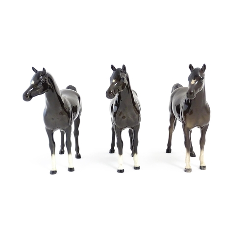 126 - Three Beswick models of dark brown Arab horses. Approx. 6