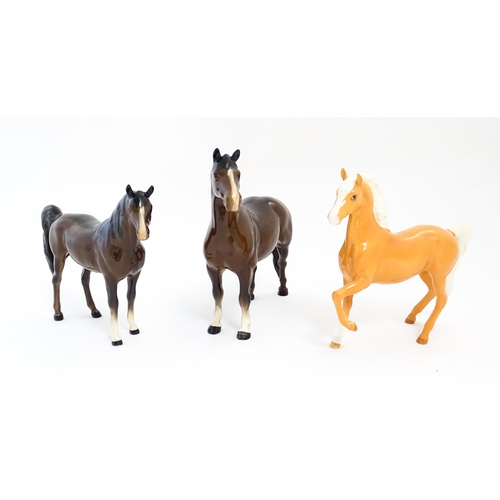 127 - Three Beswick models of horses to include a Prancing Arab palomino, a brown Arab horse, and another.... 