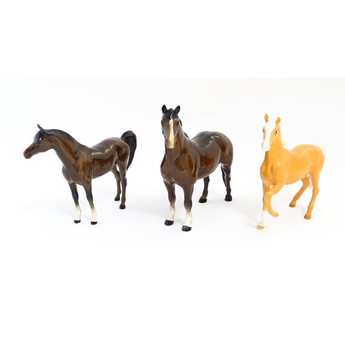 127 - Three Beswick models of horses to include a Prancing Arab palomino, a brown Arab horse, and another.... 