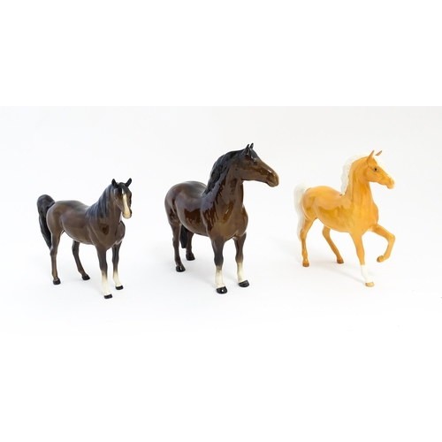 127 - Three Beswick models of horses to include a Prancing Arab palomino, a brown Arab horse, and another.... 