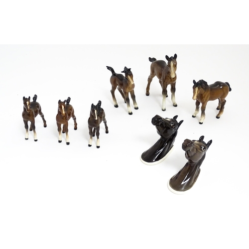 128 - A quantity of Beswick brown horses / foals model no. 763 etc. Together with two Beswick Arab head wa... 