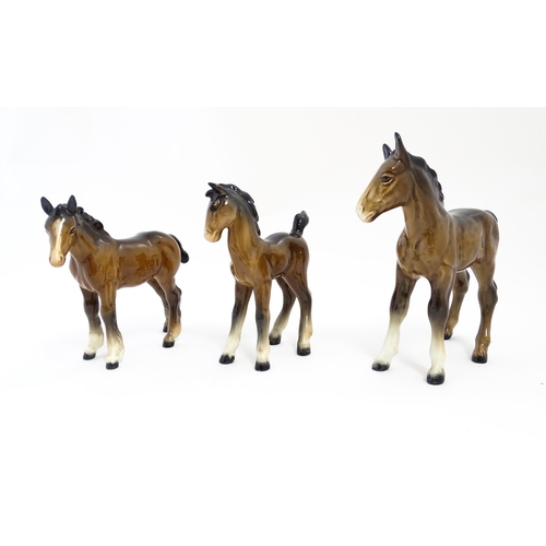 128 - A quantity of Beswick brown horses / foals model no. 763 etc. Together with two Beswick Arab head wa... 