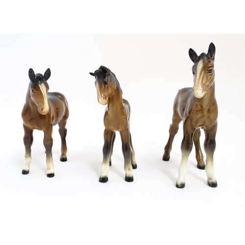 128 - A quantity of Beswick brown horses / foals model no. 763 etc. Together with two Beswick Arab head wa... 