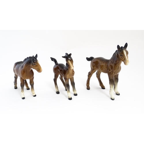 128 - A quantity of Beswick brown horses / foals model no. 763 etc. Together with two Beswick Arab head wa... 