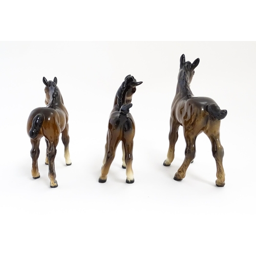 128 - A quantity of Beswick brown horses / foals model no. 763 etc. Together with two Beswick Arab head wa... 