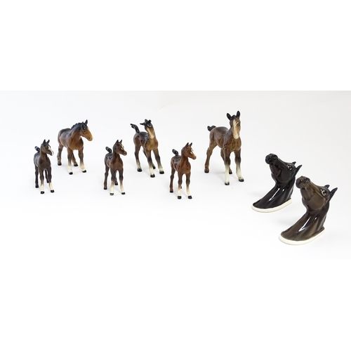 128 - A quantity of Beswick brown horses / foals model no. 763 etc. Together with two Beswick Arab head wa... 