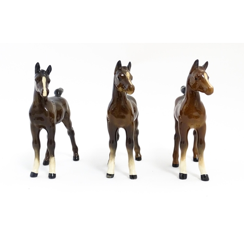 128 - A quantity of Beswick brown horses / foals model no. 763 etc. Together with two Beswick Arab head wa... 