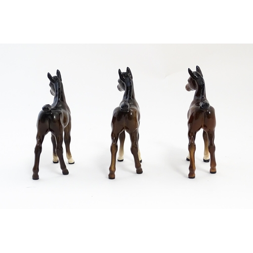 128 - A quantity of Beswick brown horses / foals model no. 763 etc. Together with two Beswick Arab head wa... 