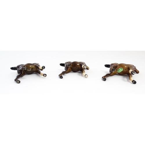 128 - A quantity of Beswick brown horses / foals model no. 763 etc. Together with two Beswick Arab head wa... 