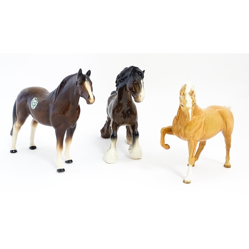 129 - Two Beswick models of horses comprising a palomino Prancing Arab model no. 1261, and a brown canteri... 