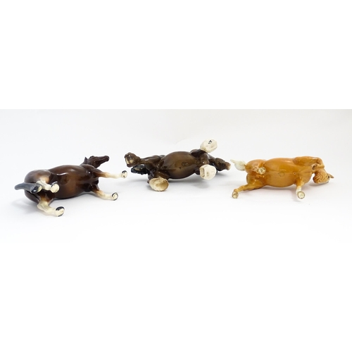 129 - Two Beswick models of horses comprising a palomino Prancing Arab model no. 1261, and a brown canteri... 