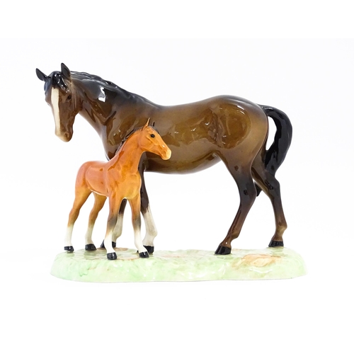 130 - A Beswick horse group depicting Mare and Foal, model no. 953. Approx. 7 1/4