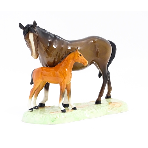 130 - A Beswick horse group depicting Mare and Foal, model no. 953. Approx. 7 1/4