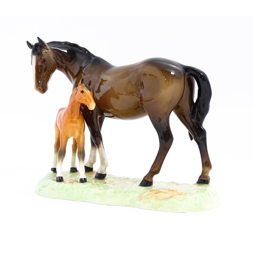 130 - A Beswick horse group depicting Mare and Foal, model no. 953. Approx. 7 1/4