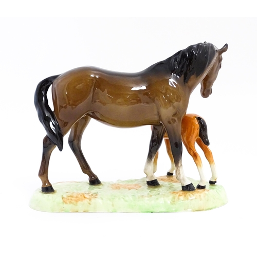 130 - A Beswick horse group depicting Mare and Foal, model no. 953. Approx. 7 1/4